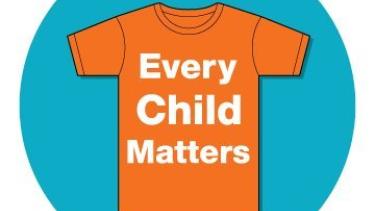 Orange t-shirt with white text saying "Every Child Matters"